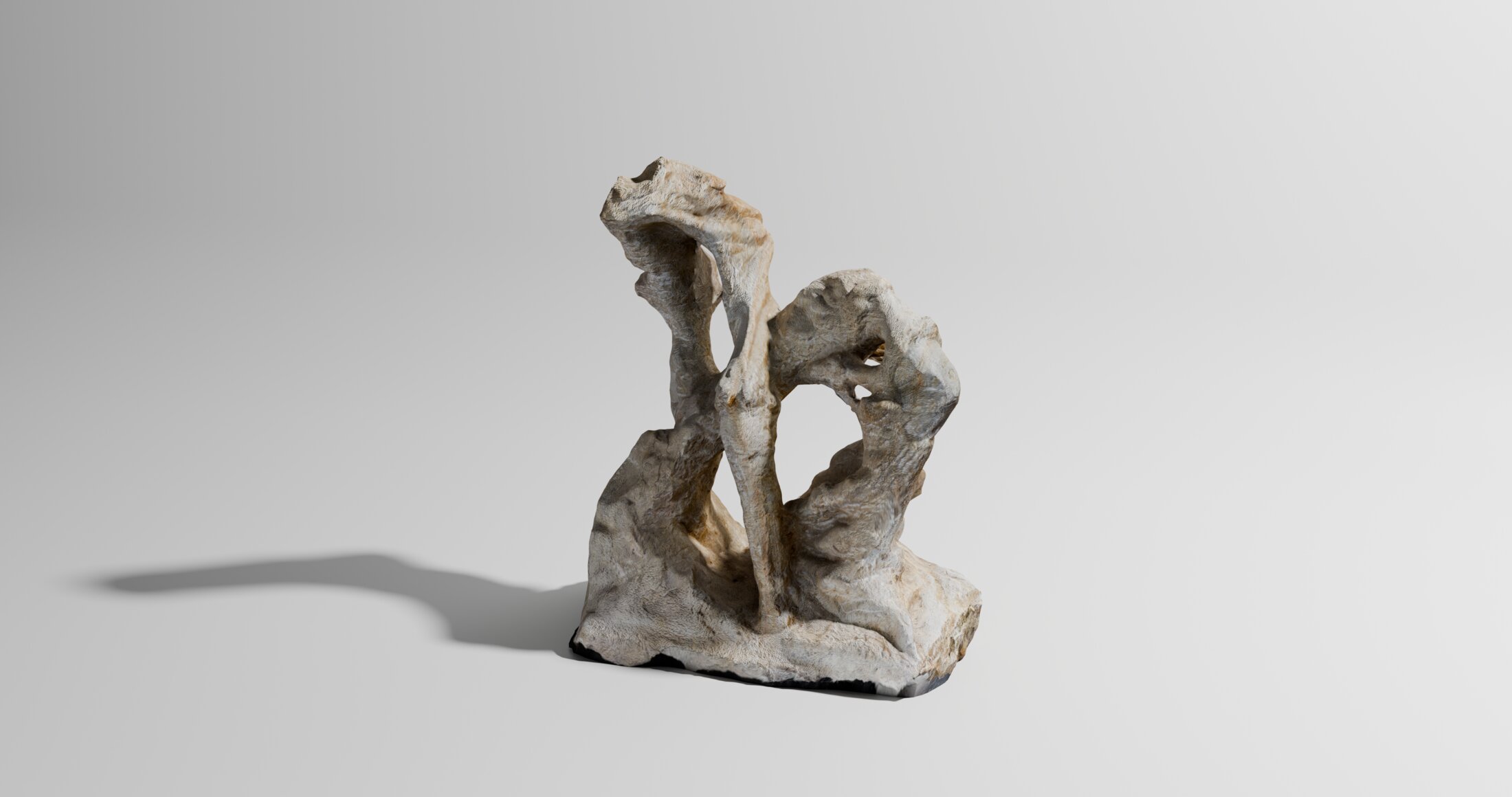 Sandstein: a hollowed sandstone form carved into flowing folds around an arched opening